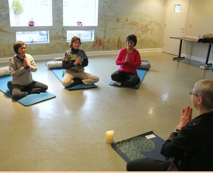women taking a yoga class