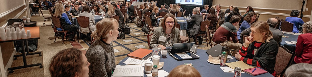 numerous roundtable sessions occurring at a conference