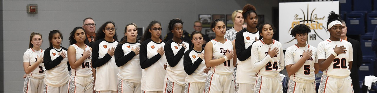 youth basketball team standing for the National Anthem