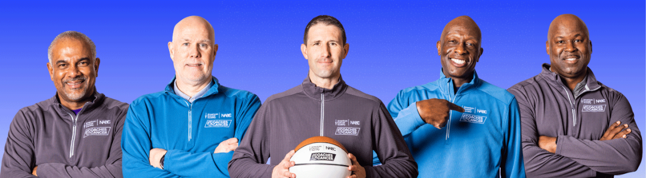 Five men in Coaches vs. Cancer jackets posing with basketball.