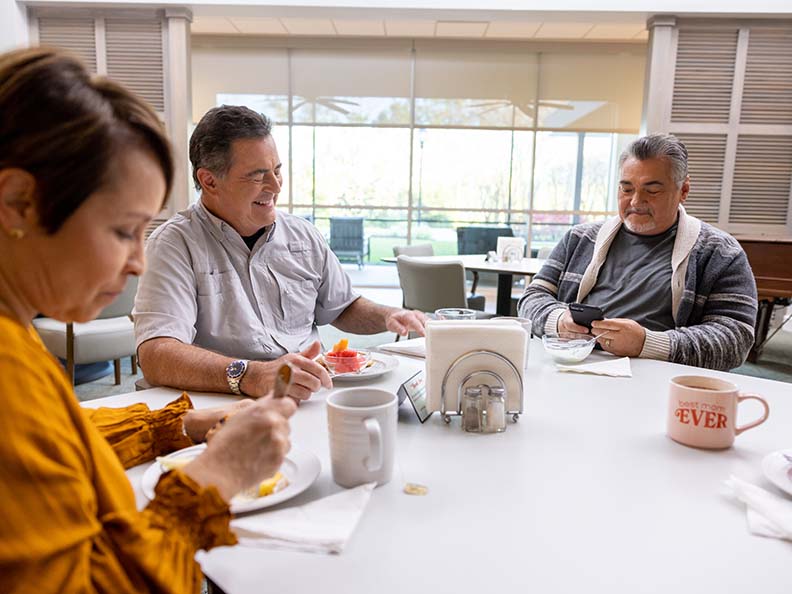 group of people sitting at a round table