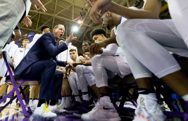 basketball coach with players