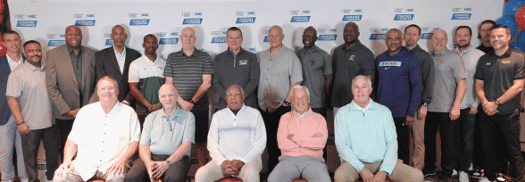 Group of men posing together at Coaches vs. Cancer event.