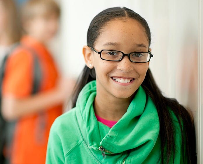 black mixed child facing camera smiling