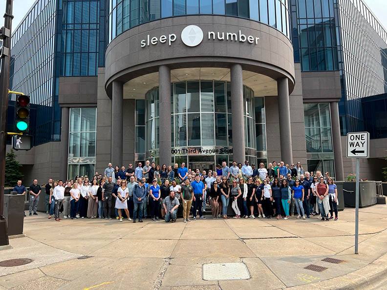 Large group of people outside Sleep Number corporate building