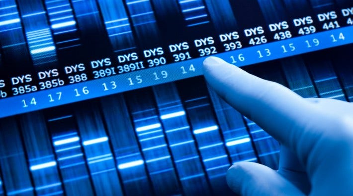 gloved hand points to a dna test sequence