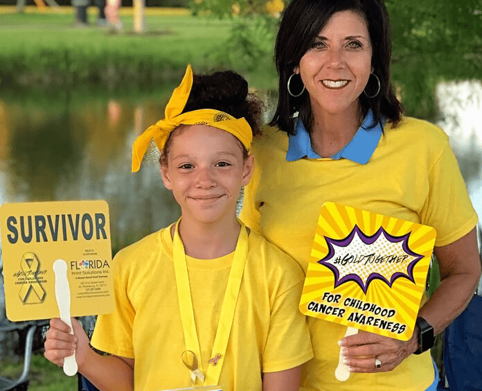 woman and girl smiling for Gold Together event