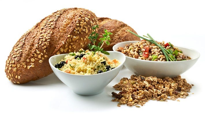 assortment of whole wheat foods, breads