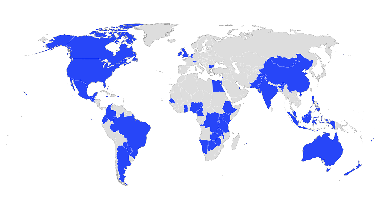 A world map highlighting selected countries in blue across North America, South America, Europe, Africa, the Middle East, Asia, and Oceania. The highlighted countries include the United States, Canada, Mexico, several Central and South American countries, multiple European nations, numerous countries in Africa, large portions of South and East Asia including China and India, and Australia. All other countries are shown in light gray.