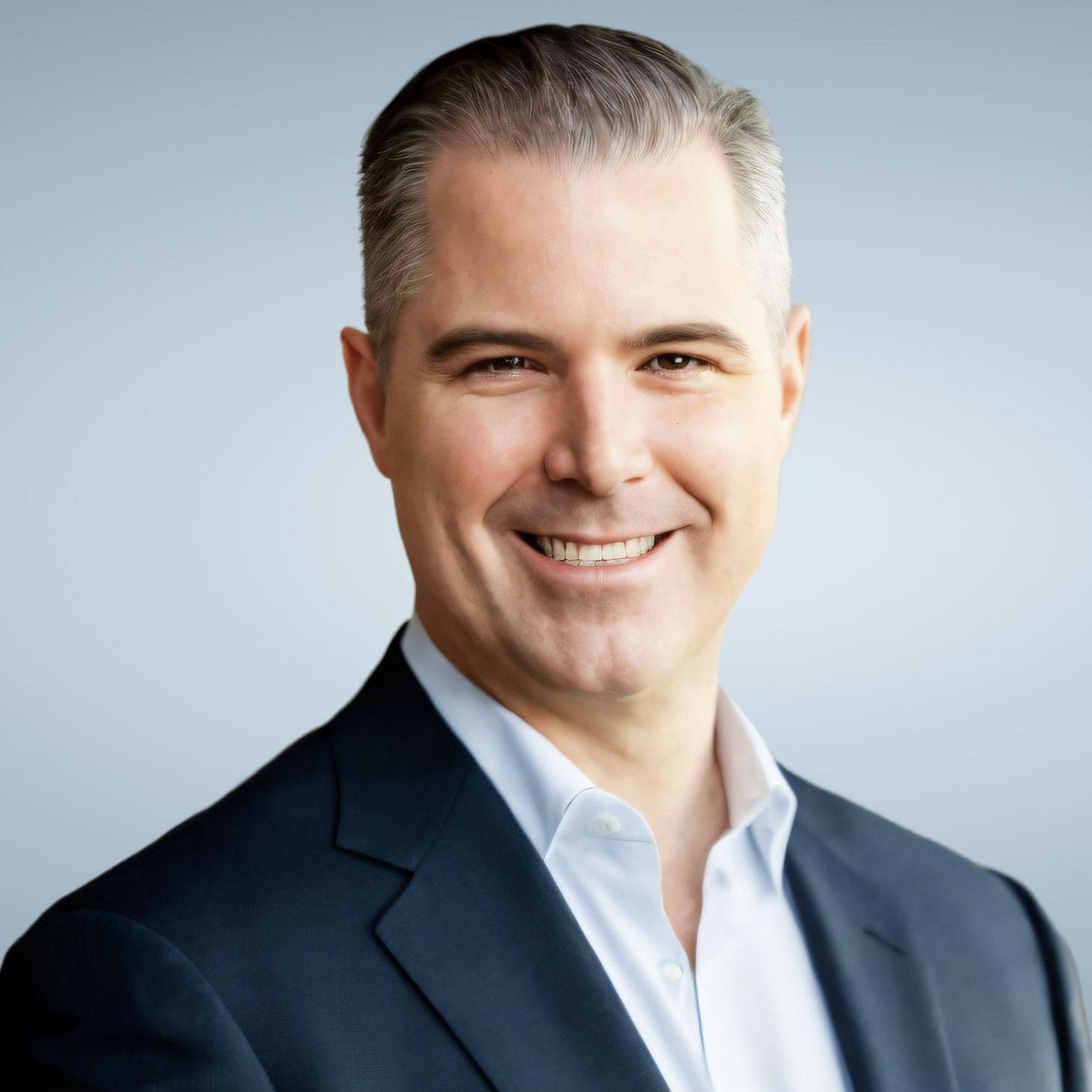 Portrait of Bryan McLaughlin with a grey background