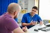doctor talks to man in an office