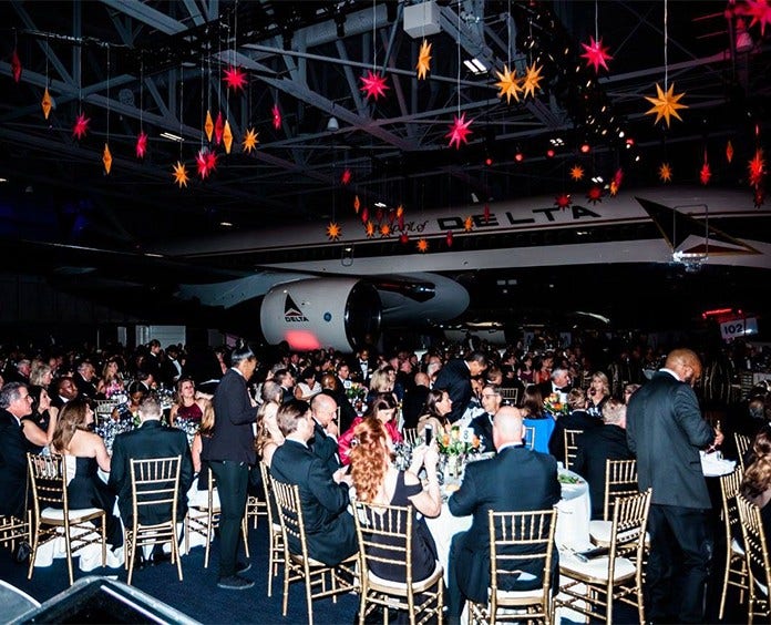 Delta Hope Ball event attendees sitting at tables