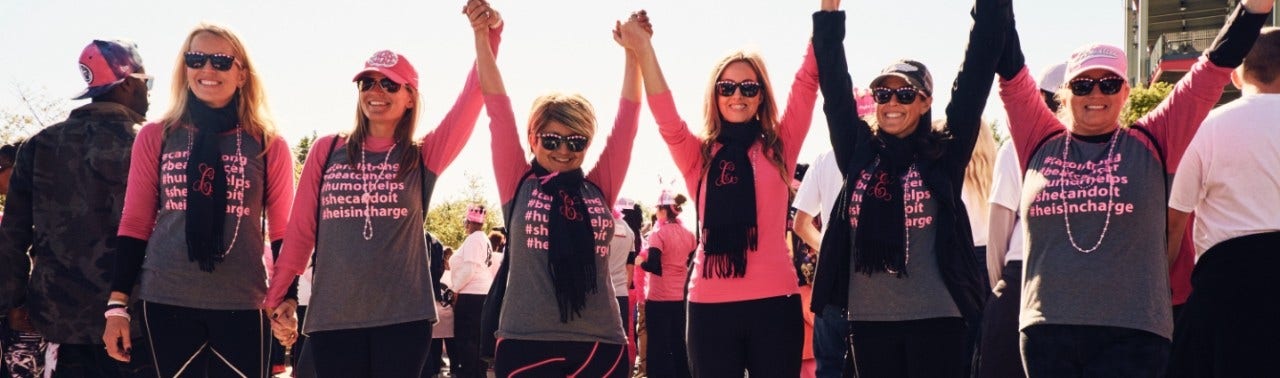 group of caucasian females holding hands