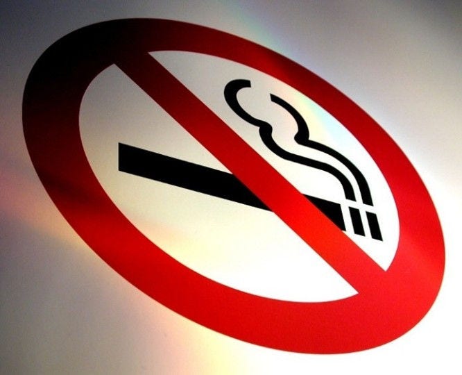 red circle slashing through a cigarette icon