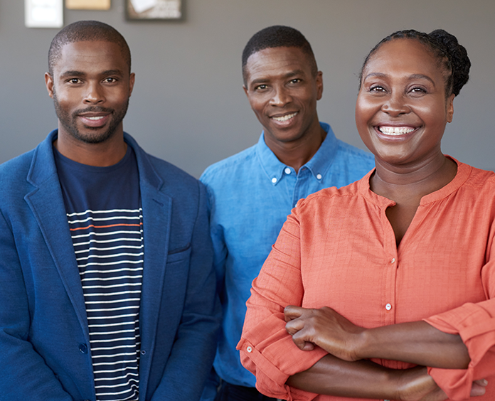 black mother and father standing with son