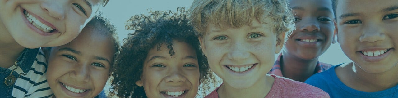 children smiling together for the camera