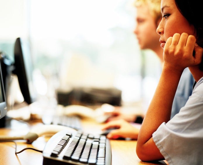 young woman working at computer