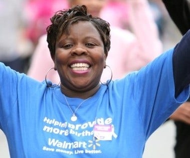 smiling african american walmart employee at strides event