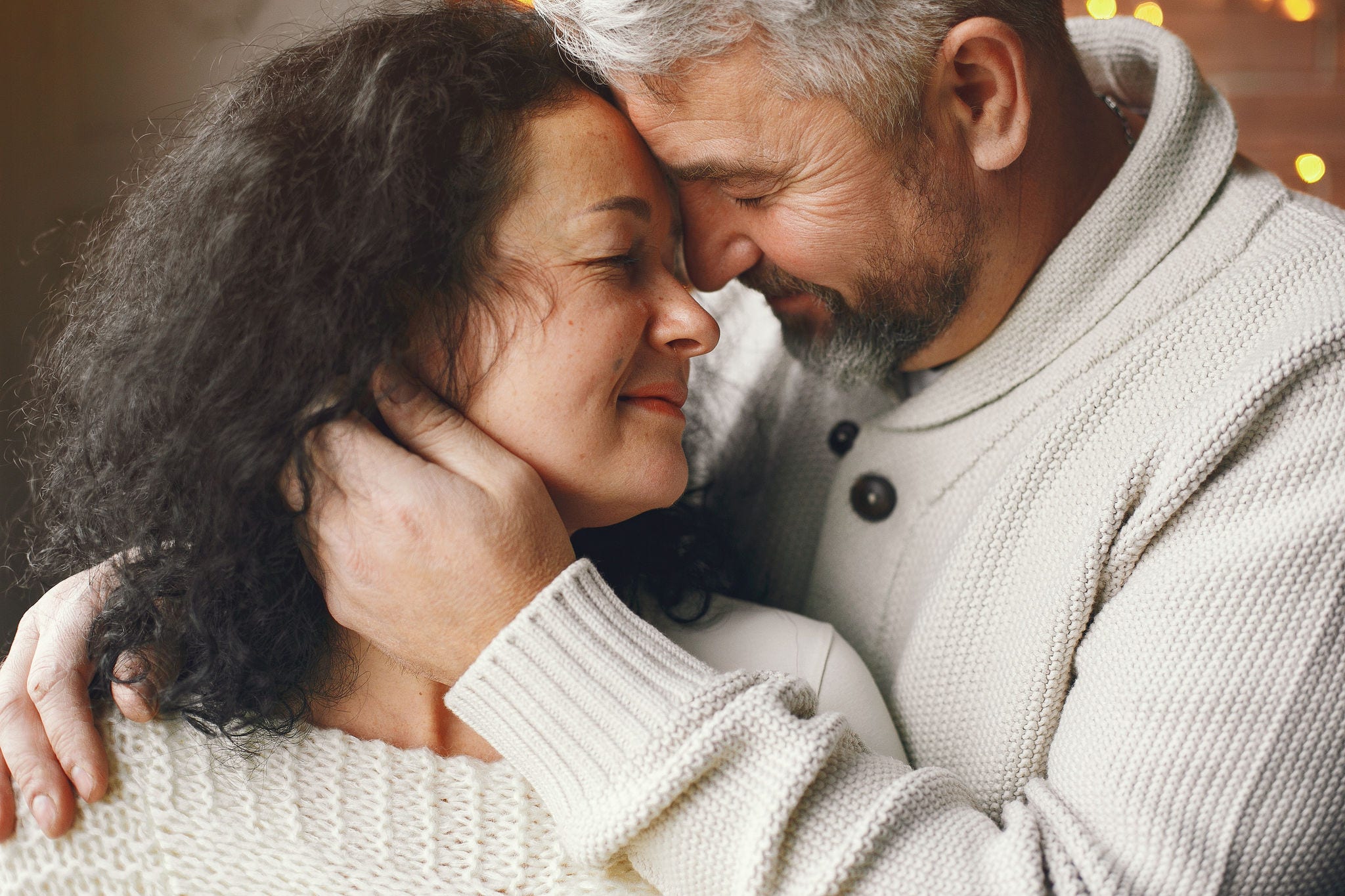 black young woman hugging a black man facing her