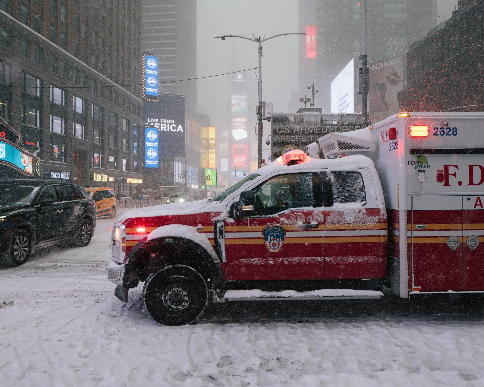 Ambulance pulling into road during snow