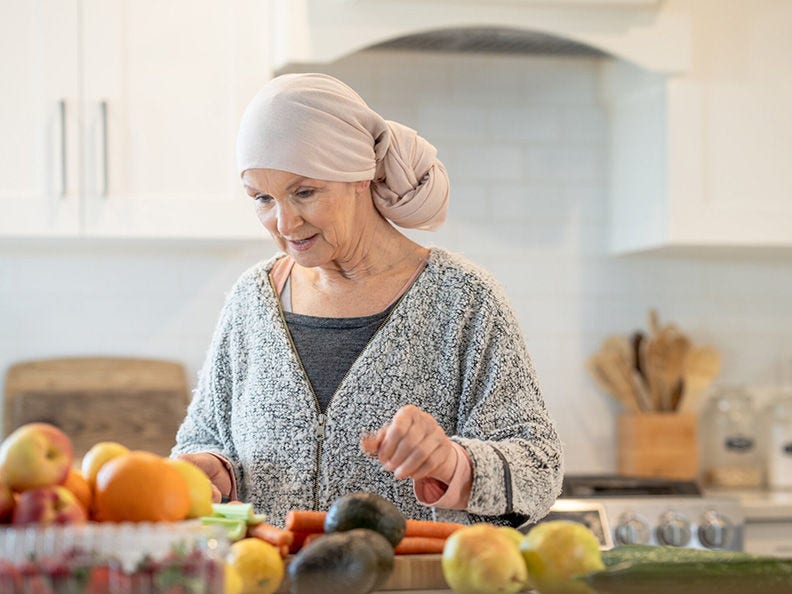 A cancer survivor making nutricious health choice in the kitchen