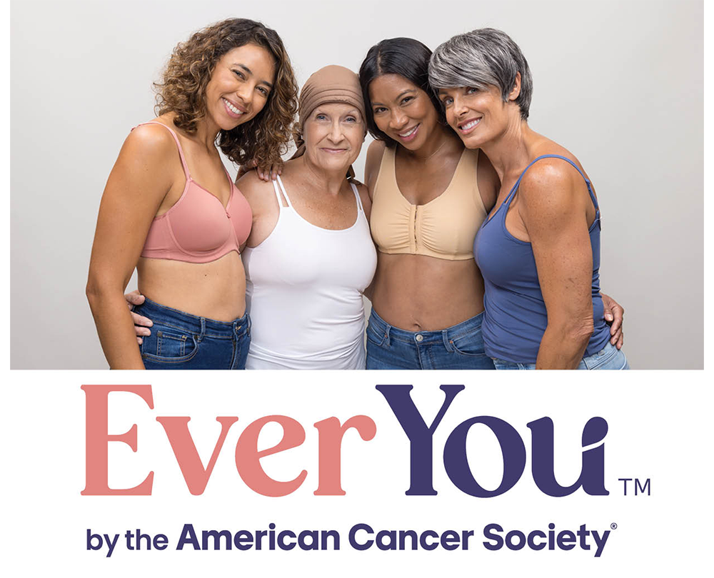 Four smiling women posing for American Cancer Society campaign.