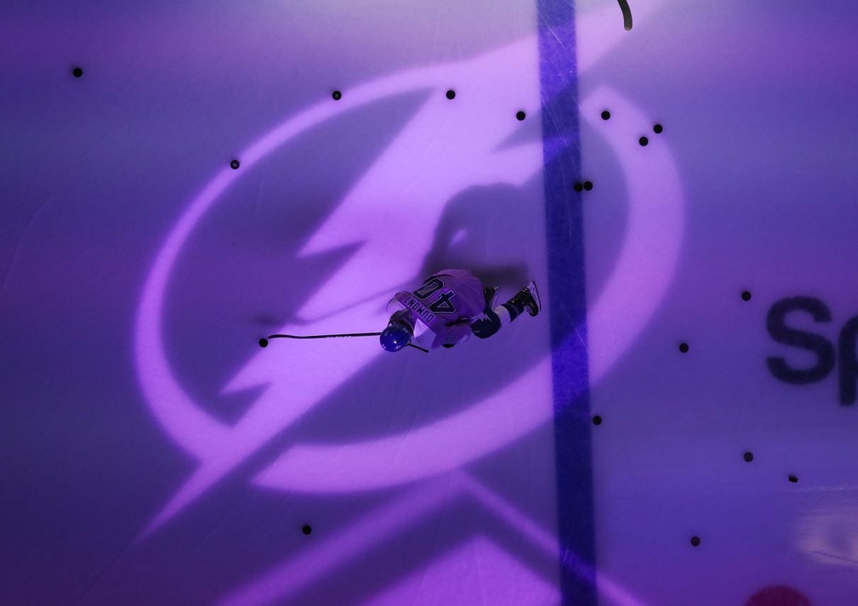 Hockey player in the middle of ice hockey rink