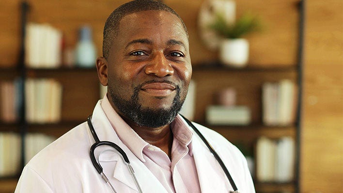 African American male doctor wearing white coat and stethoscope