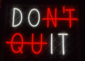 Black square white letters say DO IT and red letters are crossed out Don't Quit