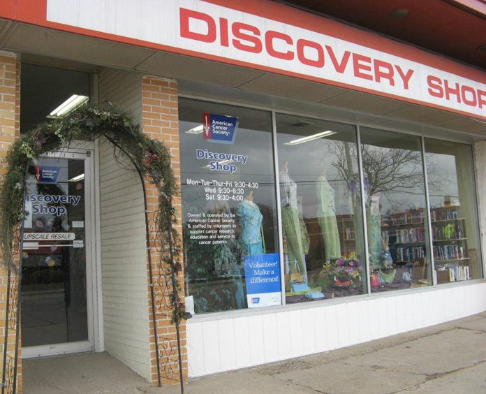 Close-up of the front of the Discovery Shop building with a sign that says "Discovery Shop".