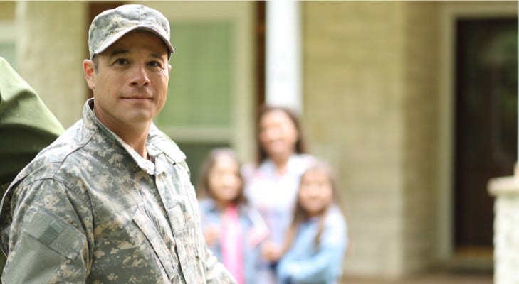 military worker smiling at camera