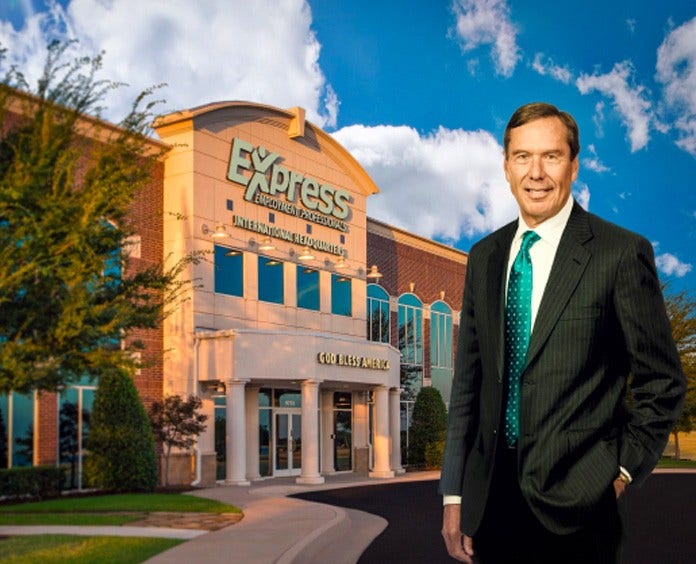 Bill Stoller standing outside in front of large building