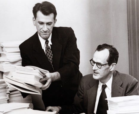 Dr. E. Cuyler Hammond (right), Director of Statistical Research, and Dr. Daniel E. Horn collect data for a 1950's landmark study on the link between smoking and lung cancer.