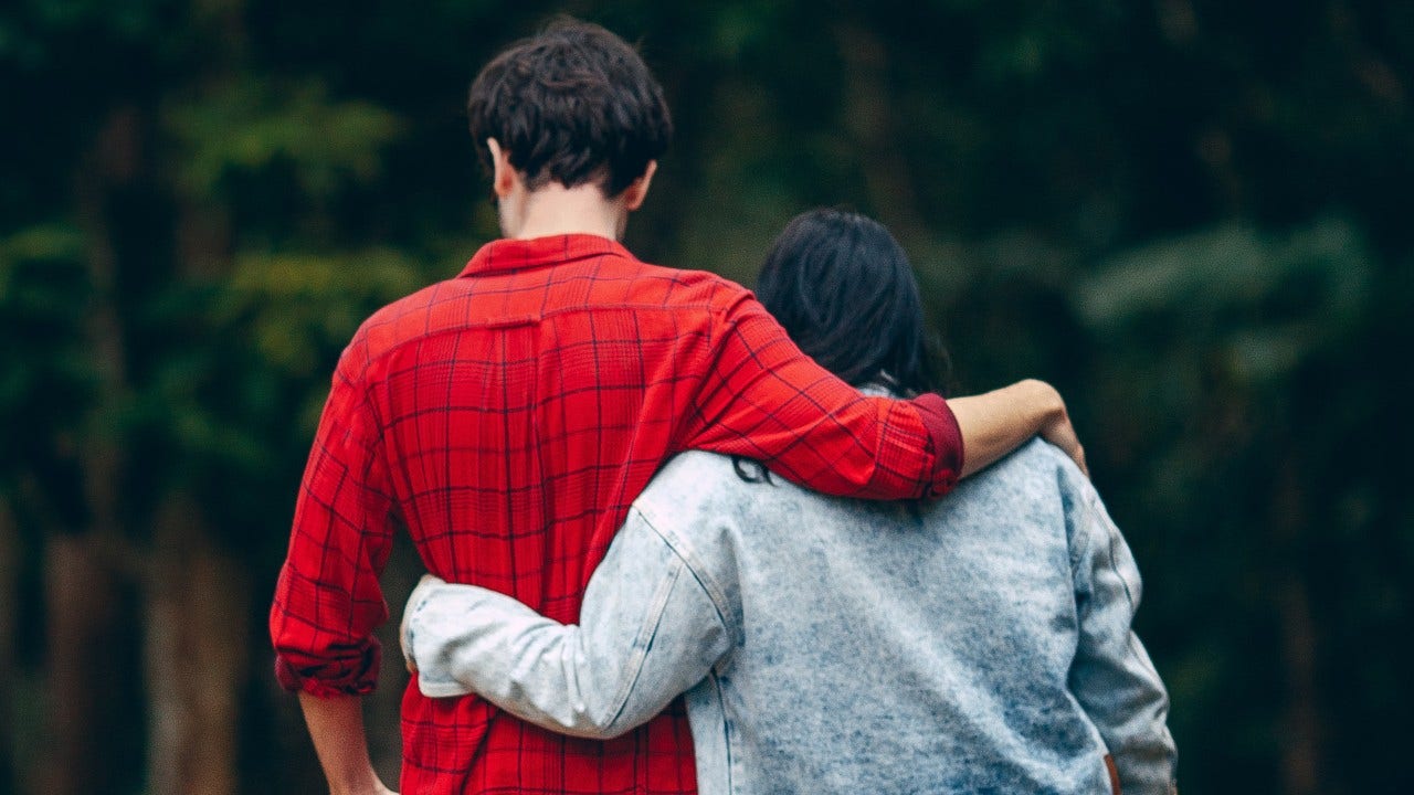 Couple Walking with Arm Around Each Other