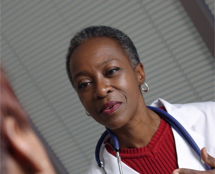 African American doctor speaking with patient