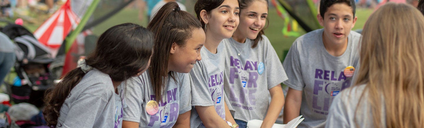 six women gathered during an event