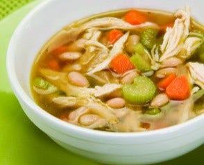 close up of a bowl of chicken and white bean soup