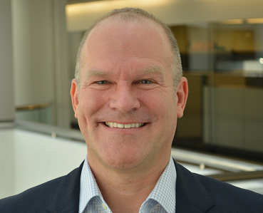 close up portrait of Peter J. Briggs, MPH Director, Study and Biospecimen Management, Epidemiology Research Program