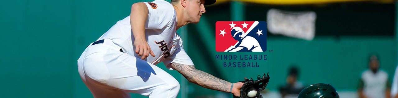 Image of Minor League Baseball player catching a ball