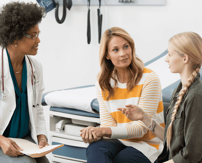 Mother and daughter at a doctor's visit