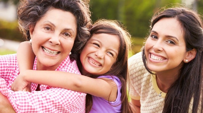 grandmother, daughter and granddaughter in park