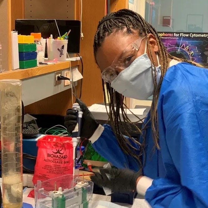 black girl intern working in medical lab