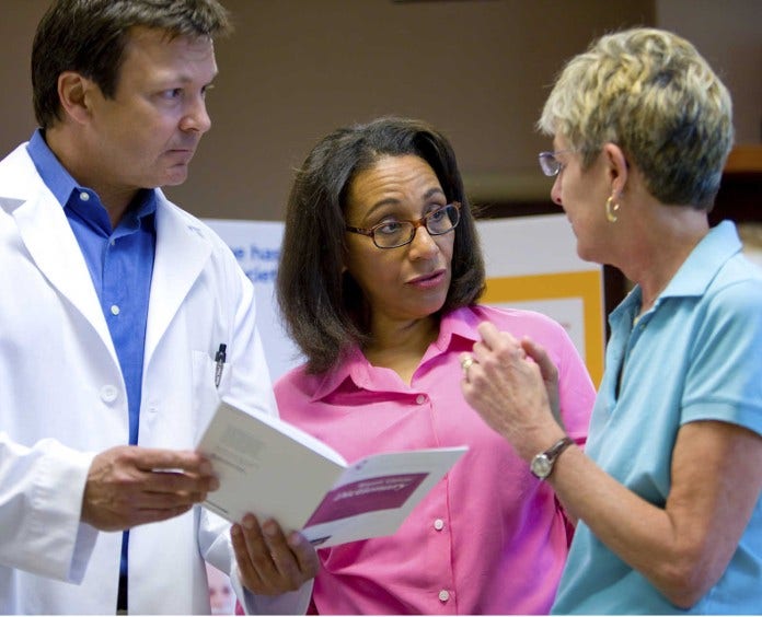 Doctor Talking to Patient and Her Friend