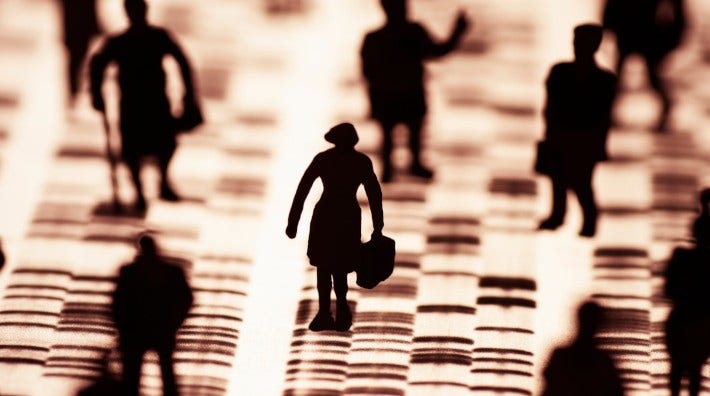 silhouettes of people standing on a DNA profile, focusing on the silhouette of a woman