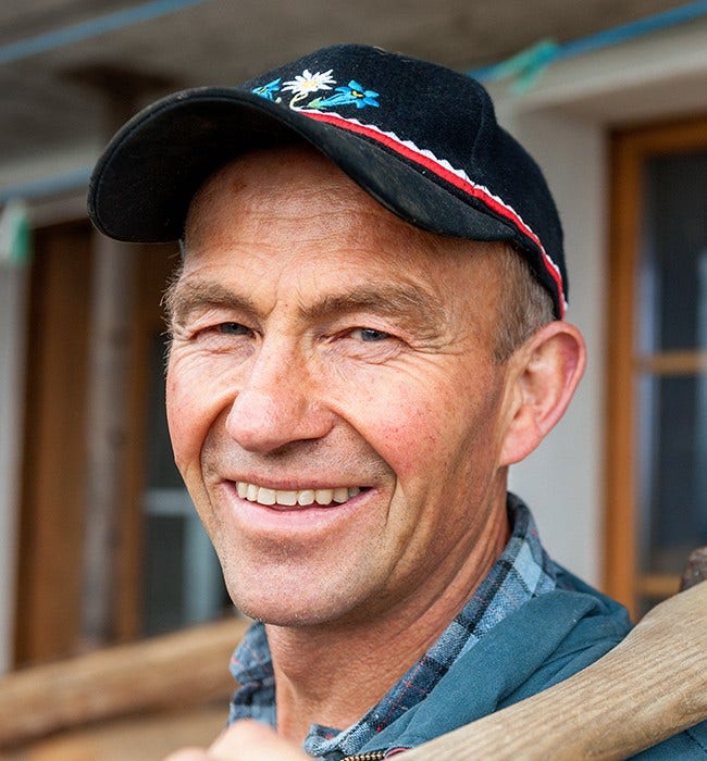 smiling man in cap