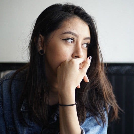 concerned young woman thinking