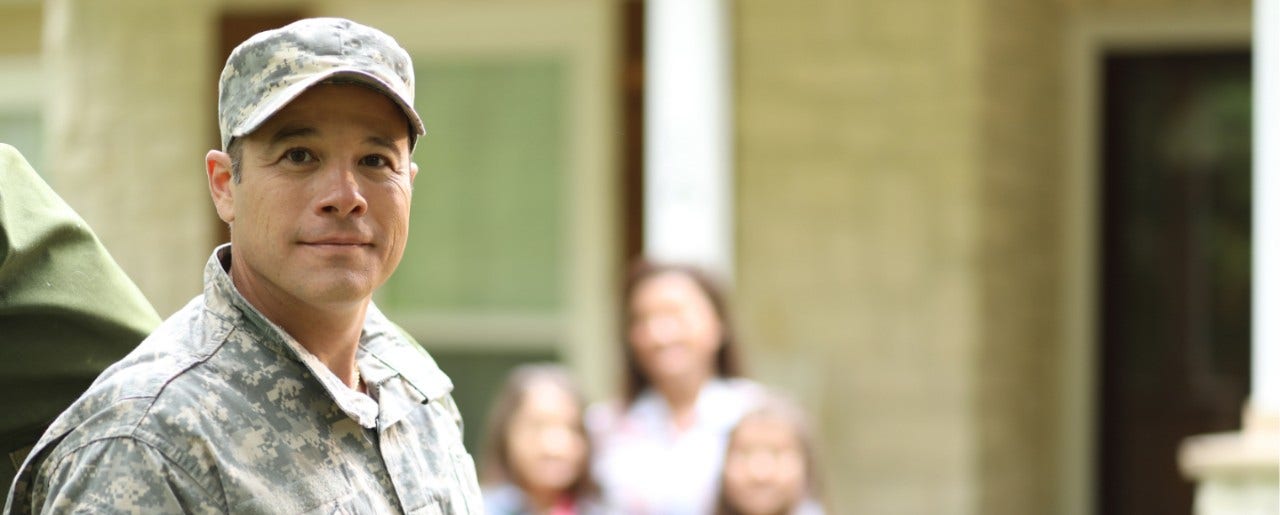 military worker smiling at camera