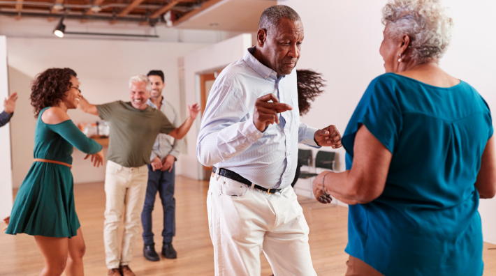 diverse group of people dancing during dance class