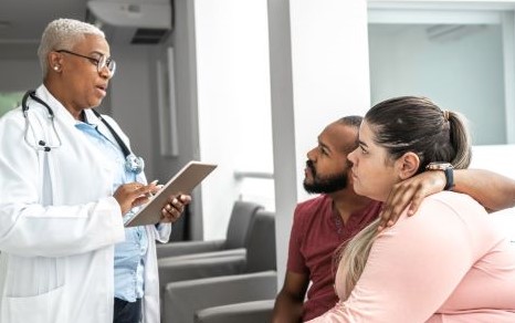 Healthcare provider discussing test results with couple