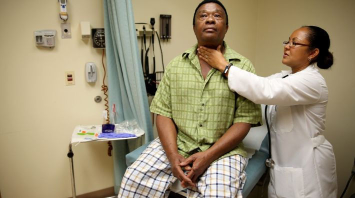 Black man seeing doctor for a prostate exam